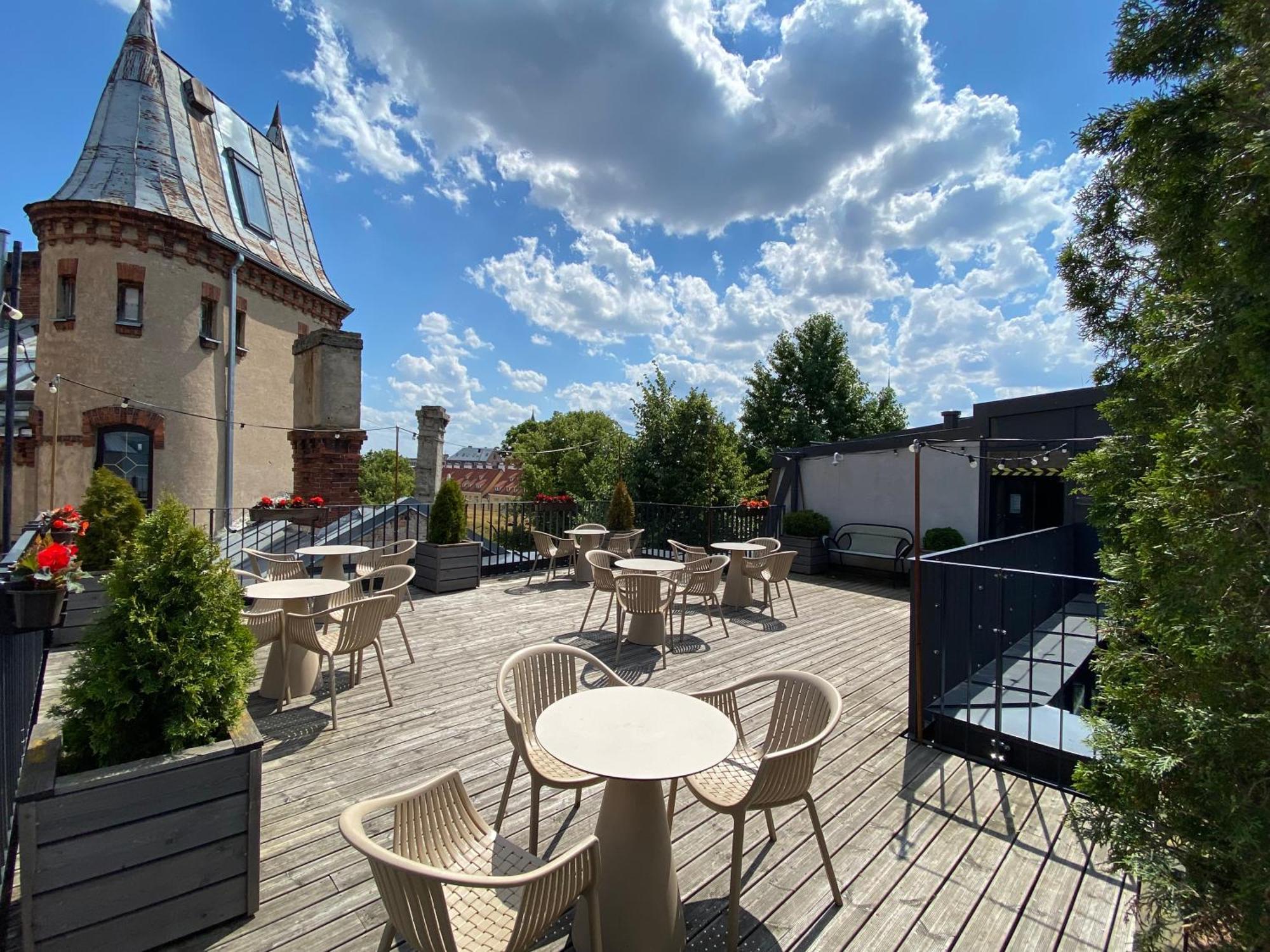 Pullman Riga Old Town Hotel Bagian luar foto The rooftop terrace at the hotel