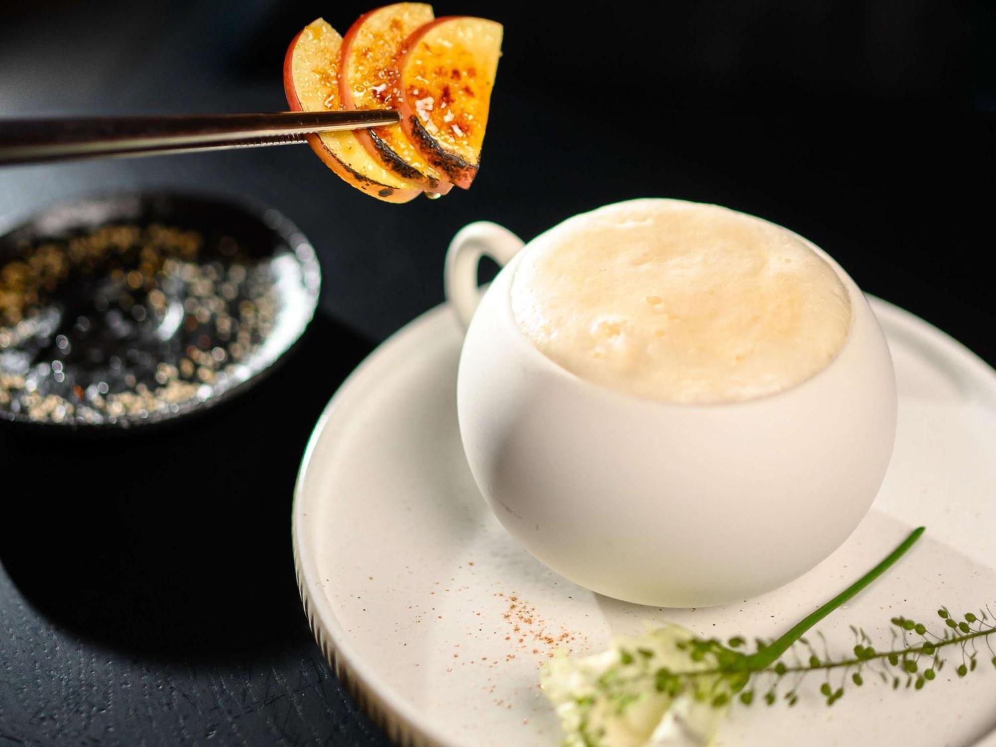Pullman Riga Old Town Hotel Bagian luar foto A cup of coffee with a slice of orange